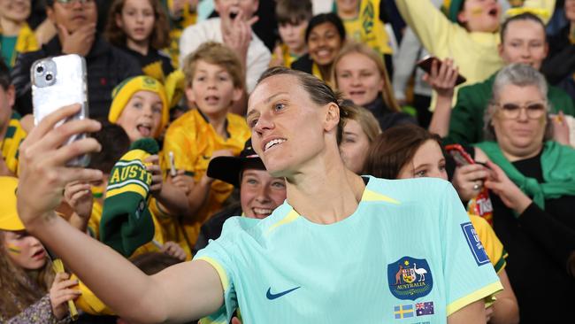 BRISBANE, AUSTRALIA - AUGUST 19: Emily Van-Egmond of Australia takes a selfie with fans after the FIFA Women's World Cup Australia & New Zealand 2023 Third Place Match match between Sweden and Australia at Brisbane Stadium on August 19, 2023 in Brisbane, Australia. (Photo by Cameron Spencer/Getty Images)