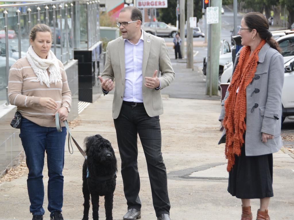 Hope's trainer Vanessa Curtis, Toowoomba South MP David Janetzki and Hope's secondary handler Christine Bartlett with Hope outside Toowoomba courthouse.