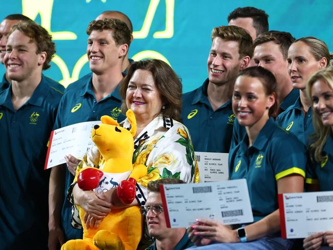 ‘Saviour’: Gina Rinehart poses for a photo with members of the Australian swimming team for the 2024 Paris Olympic Games at Brisbane Aquatic Centre in June. Picture: Getty Images