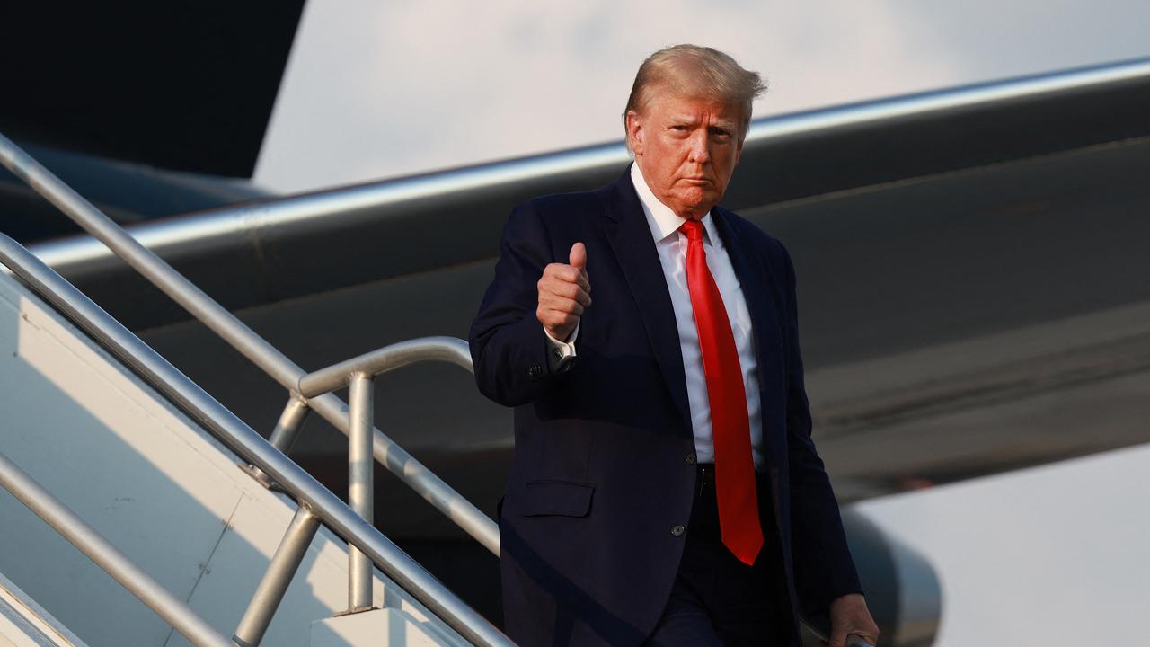 Former US President Donald Trump gives a thumbs up as he arrives at Atlanta Hartsfield-Jackson International Airport. Picture: AFP