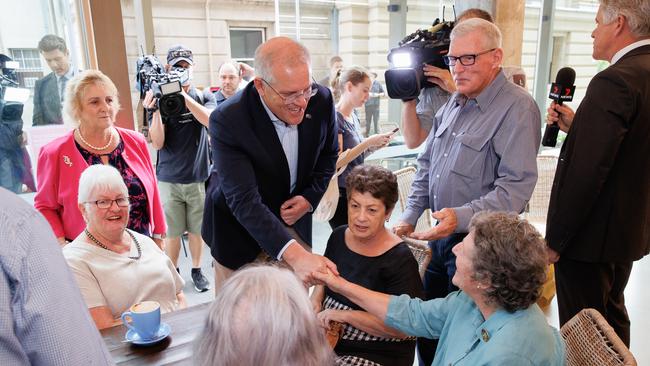 Prime Minister Scott Morrison with Michelle Landry visiting seniors at Hummingbird cafe in Rockhampton to discuss cost of living pressures. Picture: Jason Edwards