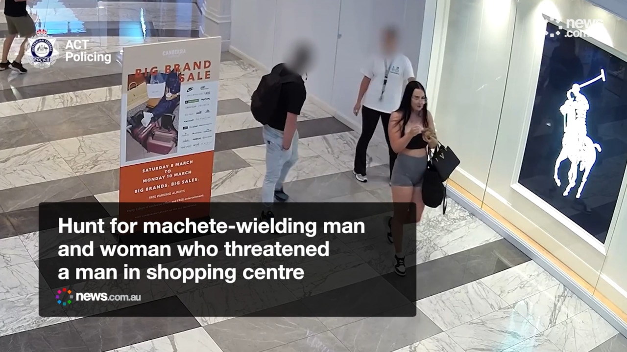 Hunt for machete-wielding man and woman who threatened a man in shopping centre