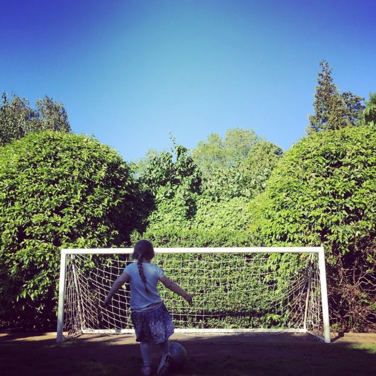 "Mia Hamm eat your heart out... Harper Seven taking lessons from her brothers ( oh and her dad )" Picture: David Beckham/Instagram