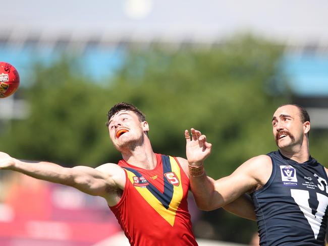 Brayden Crossley in a ruck battle with Harry Boyd in last year’s state clash. Photo: Maya Thompson/AFL Photos/via Getty Images