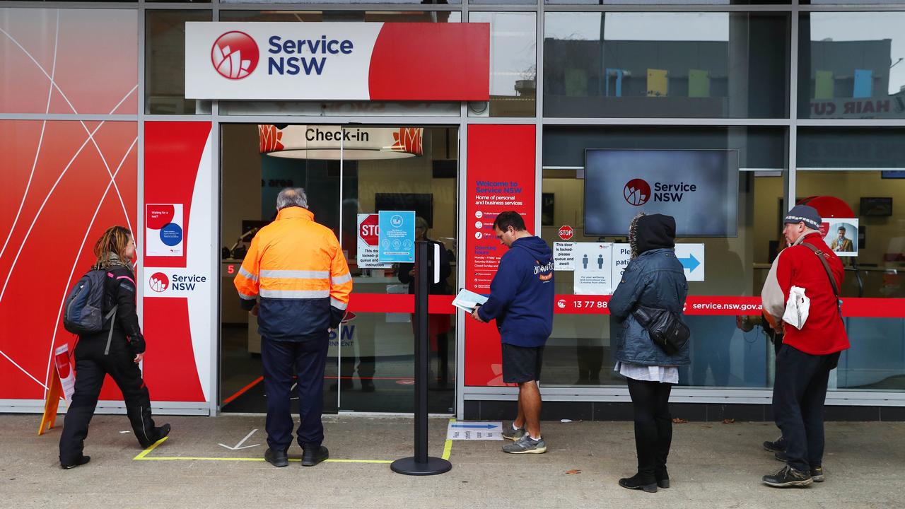 People lined up outside Services NSW in Albury on Tuesday with some renewing the address on their licence. Picture: Aaron Francis/The Australian
