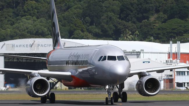 A Jetstar Airbus A320 passenger jet plane touches down at the Cairns Airport. PICTURE: BRENDAN RADKE