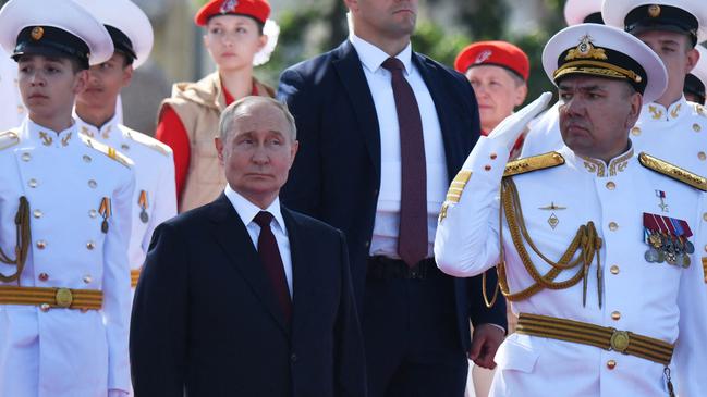 President Vladimir Putin and Commander-in-Chief of the Russian Navy, Admiral Alexander Moiseyev, attend the main parade marking the Russian Navy Day in Saint Petersburg at the weekend. Picture: AFP