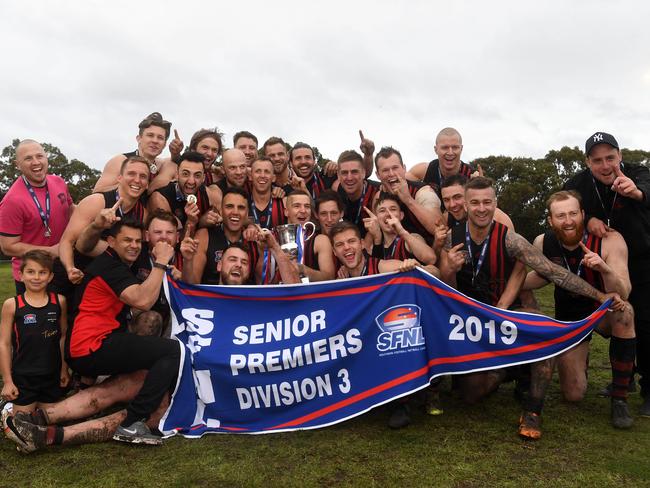 The Redbacks with their premiership flag.