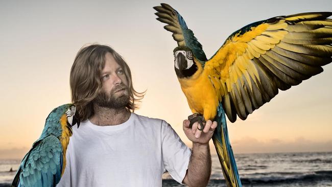 Bird trainer and rescuer Josh Cook with his macaws Mango and Crush