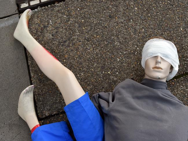 Mannequin body parts lay on the ground following a staged gas explosion and subsequent building collapse in Sydney on Sunday, May 24, 2015. About 500 people from agencies including NSW Police, Fire and Rescue and Transport NSW are taking part in the role-play. (AAP Image/Paul Miller) NO ARCHIVING