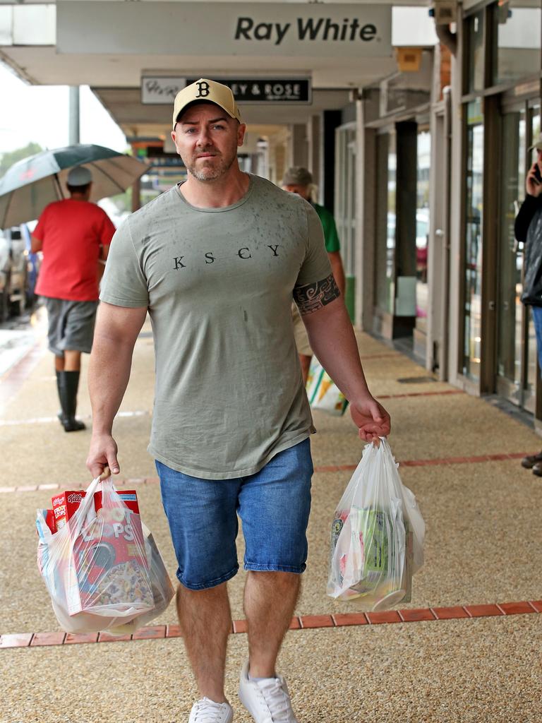 Heavy rain continues to batter the NSW mid north coast causing major flooding. Kempsey residents line up at the IGA for supplies at the only supermarket left open. Andrew Churchin from South West Rocks. Nathan Edwards