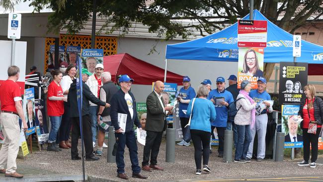 Candidates and their supporters greet voters at Runaway Bay Sports Centre when pre-poll voting opened for the seat of Fadden on Monday morning. Picture Glenn Hampson