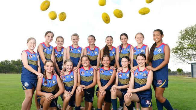 Ryan Primary Girls AFL Team are attending the State Titles in Maroochydore. (Back row L-R) Elliot Edwards, Milla Creenaune, Millie Huggett, Abbey Guy, Phoebe Gordy, Lexie Bloxsom, Isabelle Need, Alliyah Suckling, Aura Solomona, (front row L-R) Chelsea Drummond, Georgia Chapman, Felicity Doll, Sienna Hirvonen, Willow Wilesmith and Khaleesi Wilesmith, (Absent) Finella Keir and Reese Achilles. Picture: Shae Beplate.