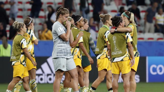 Australia players console each other on the pitch after losing the penalty shootout to Norway. Picture: AP