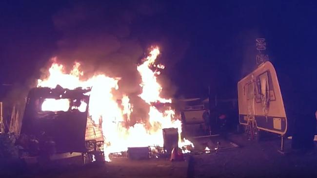 Bodywarn footage from the officer showed the caravan fully engulfed in flames when he arrived to the scene. Photo: Queensland Police