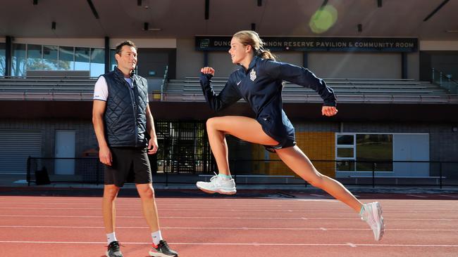 Claudia Hollingsworth with her coach Craig Mottram. Picture: Alex Coppel