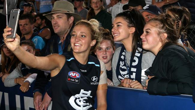 Jess Hosking poses with fans after last year’s AFLW season opener. Picture: AAP Image/Hamish Blair.