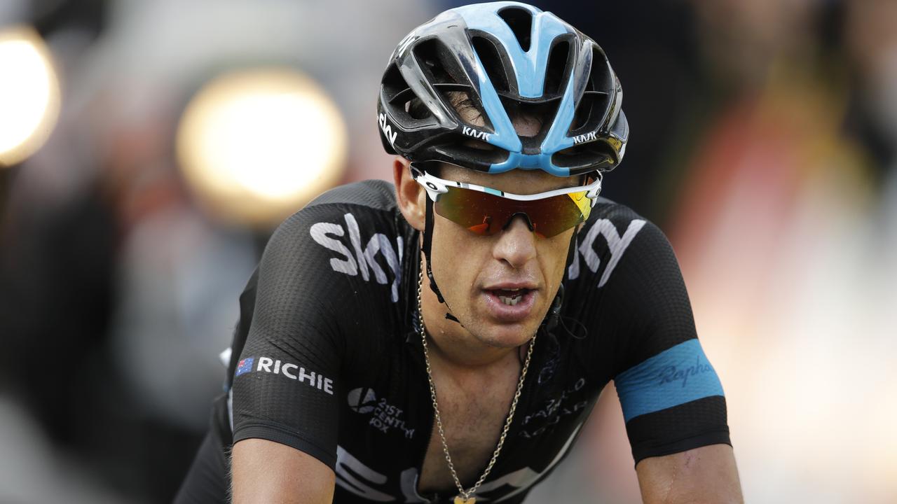 Australia's Richie Porte crosses the finish line of the tenth stage of the Tour de France cycling race over 161.5 kilometers (100.4 miles) with start in Mulhouse and finish in La Planche des Belles Filles, France, Monday, July 14, 2014. (AP Photo/Peter Dejong)