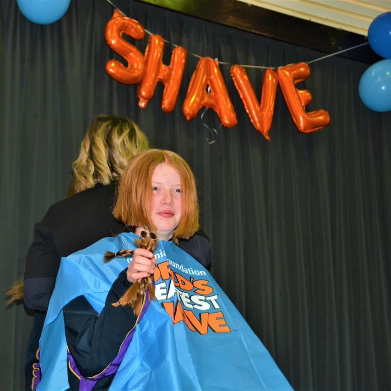 At the St Joseph's College 2023 World's Greatest Shave event is student Ellie Stagg having her hair cut. Picture: Rhylea Millar