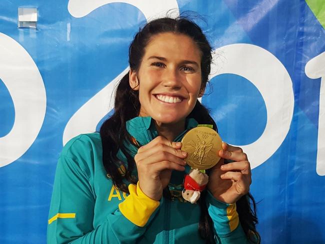 Twitter image of Sevens Rugby player Charlotte Caslick with her gold medal.