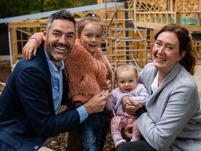 Nathan and Heike Godfrey with kids Hazel, 4, and Eugenie, 7 months, at the building site of their new Crafers home.Picture: Tom Huntley