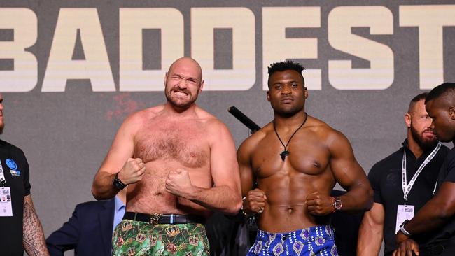 Tyson Fury and Francis Ngannou face off before their heavyweight boxing fight. (Photo by Justin Setterfield/Getty Images)