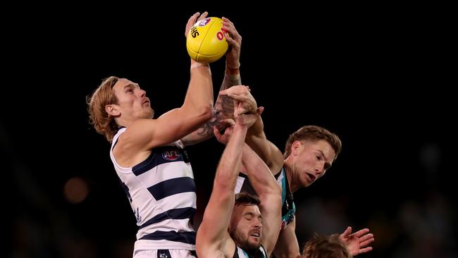 Tom Stewart soars above a pack to mark against Port Adelaide. Picture: James Elsby/AFL Photos via Getty Images.