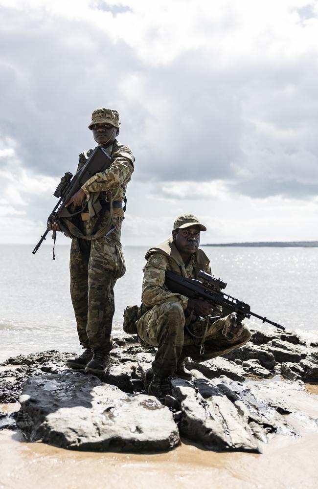 Cousins Private Francelia Rankin and Private Blake Djammarr Carter on the beach of Milikapiti, Tiwi Islands. Picture: Dylan Robinson