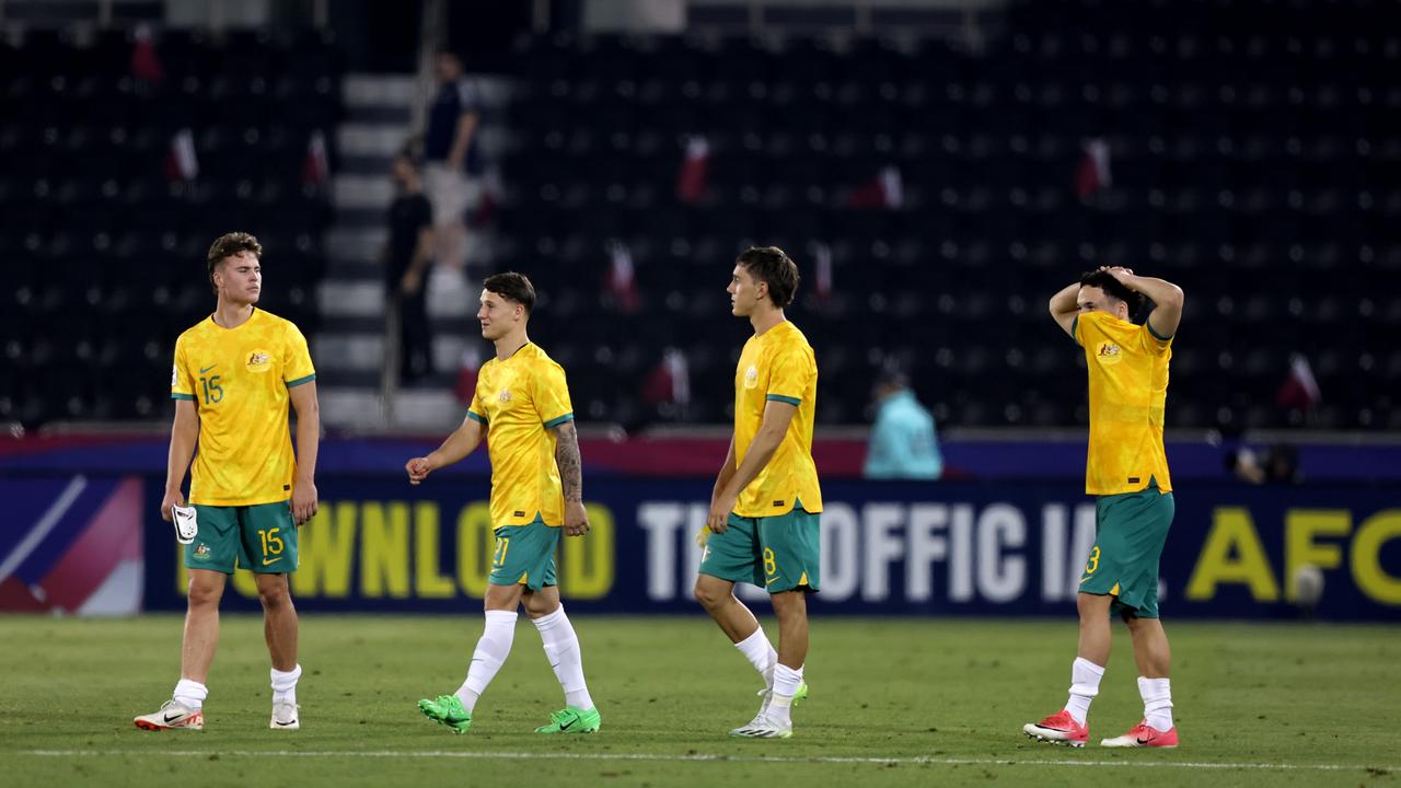 Disappointed Australian players react after the AFC U23 Asian Cup Group A match against Qatar. (Photo by Mohamed Farag/Getty Images)