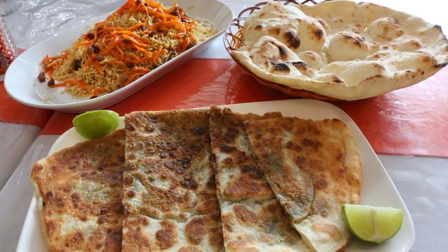 Feast on bolani, rice and bread from Mina Kebab House. Picture: Robert Pozo