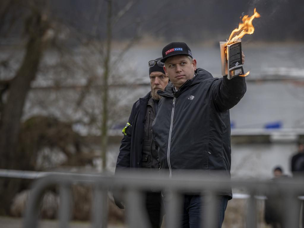 Rasmus Paludan burns the Koran outside the Turkish embassy. Picture: Jonas Gratzer/Getty Images