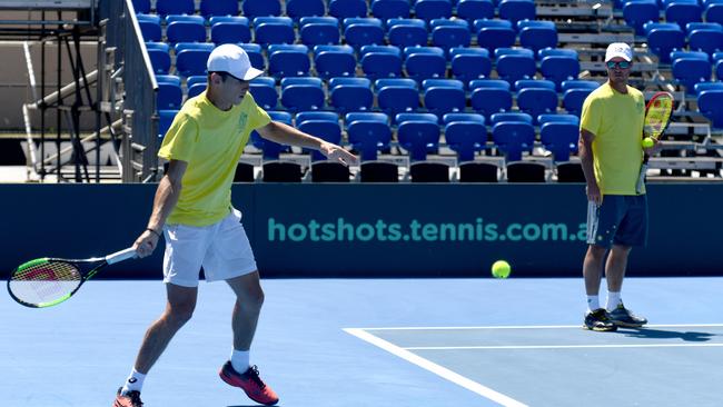 Alex De Minaur practises at Memorial Drive this week under the watchful eye of Australian captain Lleyton Hewitt ahead of the Davis Cup tie against Bosnia-Herzegovina. Picture: Tricia Watkinson