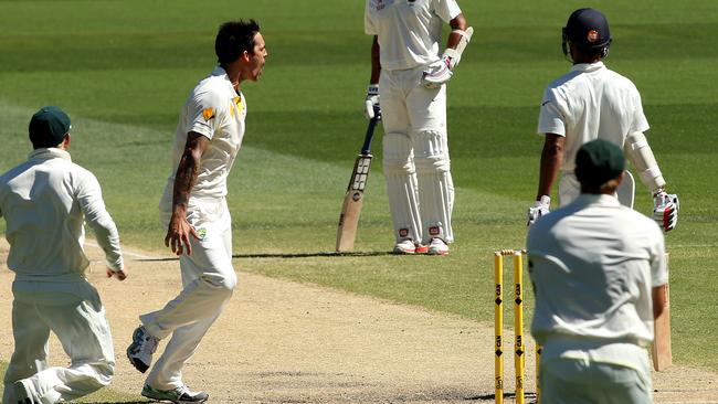 Mitchell Johnson celebrates the wicket of Shikar Dhawan on Day 5 of the 2014 Test against India. Picture: Simon Cross