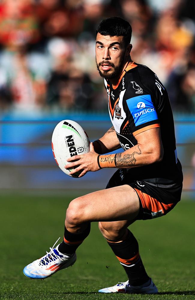 GOSFORD, AUSTRALIA – JULY 20: Charlie Staines of the Tigers looks to pass during the round 20 NRL match between South Sydney Rabbitohs and Wests Tigers at Industree Group Stadium, on July 20, 2024, in Gosford, Australia. (Photo by Mark Evans/Getty Images)