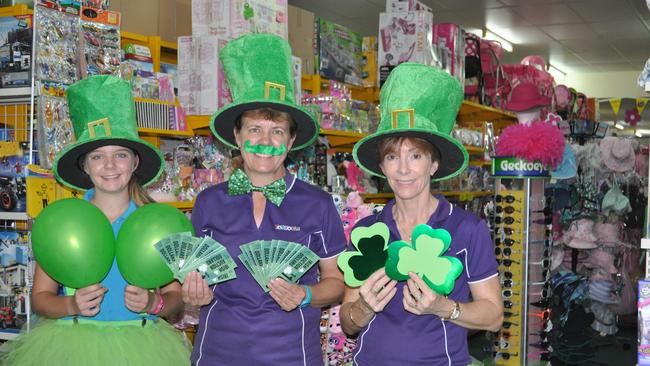 Toyworld's Kristy Mawhirt, Sue Murwhirt and Carol Ruff are decked out in green for the Bowen Locals 4 Locals Street Party in 2017.