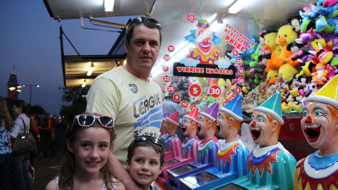 <p>Saskia, Samual and Richard Scheiwe tried their luck at some of the games at the Mardi Gras on Friday night. Photo: Erin Smith / Warwick Daily News</p>