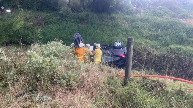 Emergency services work to retrieve a woman after losing control of her car in the wild weather. Picture: Keziah Sullivan/Nine News Adelaide