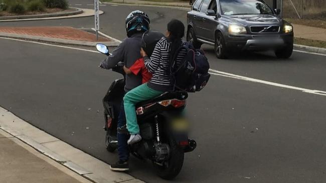 A scooter driver with an overseas licence has been fined by Quakers Hill Police after he was caught riding in The Ponds with two passengers on his bike. Picture: Quakers Hill Police Area Command