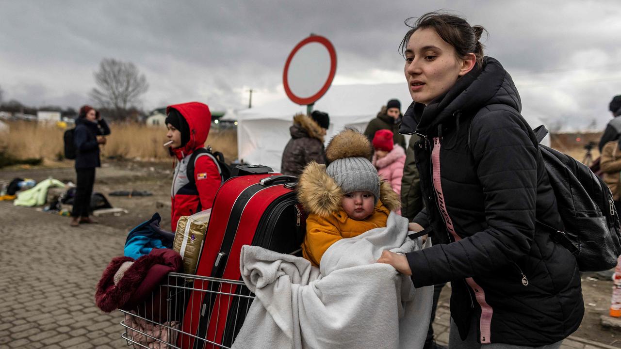 A mother and her child at the Medyka pedestrian border. Picture: Wojtek Radwanski/AFP