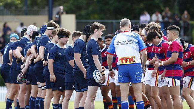 Some of the hardy Brisbane Grammar School forwards next to captain Ryan Shaw.