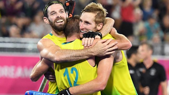 Australian hockey players celebrate after winning gold at the Commonwealth Games. Picture: AAP Images