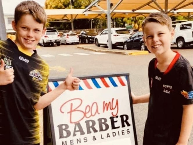 Jax, 11, and Jimmy, 9, Radnedge headed to their local barber shop to pay for two haircuts to bring cost of living relief to two customers Picture: Supplied.