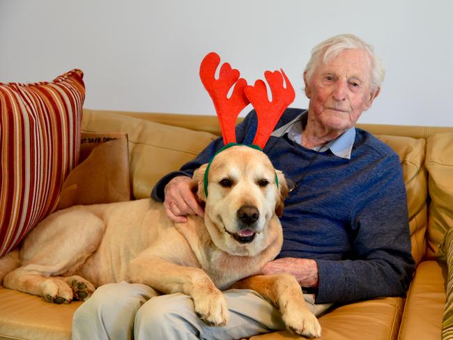 Eccles the reindeer dog with his human grandfather, World War II veteran John Irwin in Port Melbourne. Picture: Julia Irwin