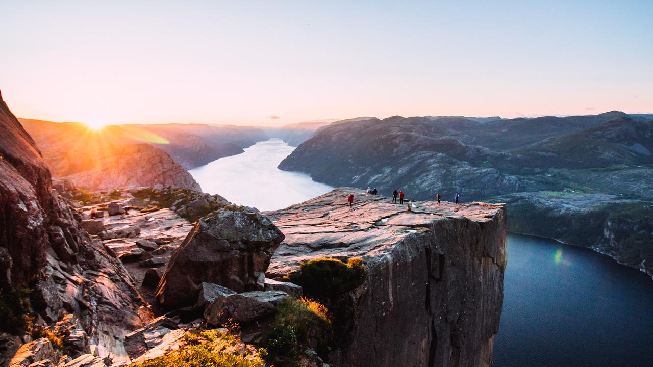 Stand on the edge of Pulpit Rock in Norway.