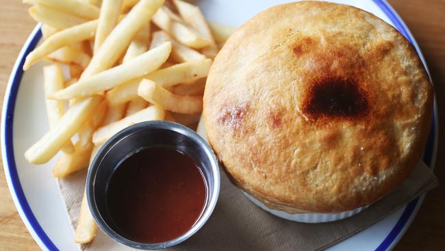 McHugo’s beef mince pot pie with tomato sauce and chips. Picture: NIKKI DAVIS-JONES