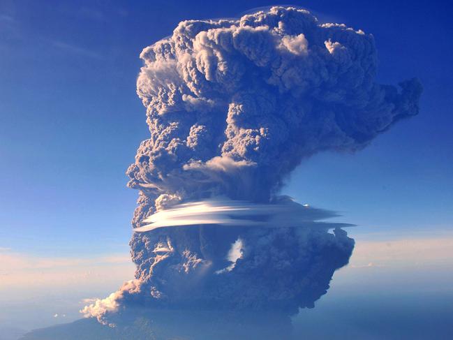 EXCLUSIVE: Mount Sangeang Api spews pyroclastic smoke on May 30, 2014, in Sangeang, Indonesia. MOUNT SANGEANG API can be seen spewing pyroclastic smoke high into the air from the window of a passing commercial flight. The pictures were taken by professional photographer Sofyan Efendi during a flight from Bali to Labuan Bajo in West Nusa Tenggara province. The flight offered Efendi the chance to get a unique vantage point on the volcanic activity, with the entire outline of the island of visible beneath the smoke. The volcano, located on one of the Lesser Sunda Islands, is one of 129 active volcanoes in Indonesia. Picture by: Barcroft Media / Splash News