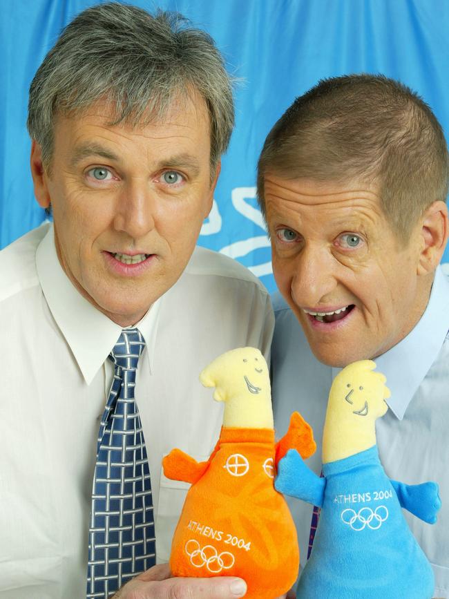 Roy Slaven, left, and Greg Pickhaver from Channel 7 show, The Dream, with the Athens Olympic mascots. Picture: News Corp