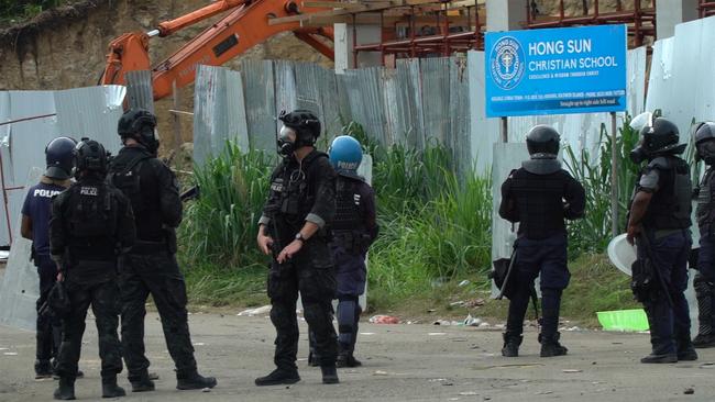 Australian Federal Police officers patrolling with local police in Honiara in November 2021. Picture: AFP