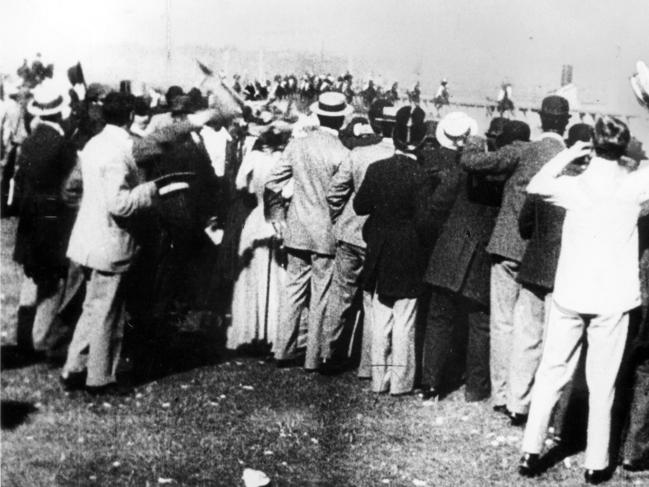 Crowds look on at the Melbourne Cup in 1896.