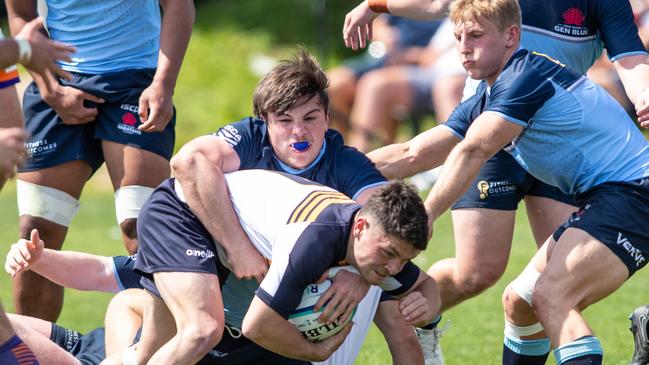 Sam Allsopp makes a tackle in the U19 match.